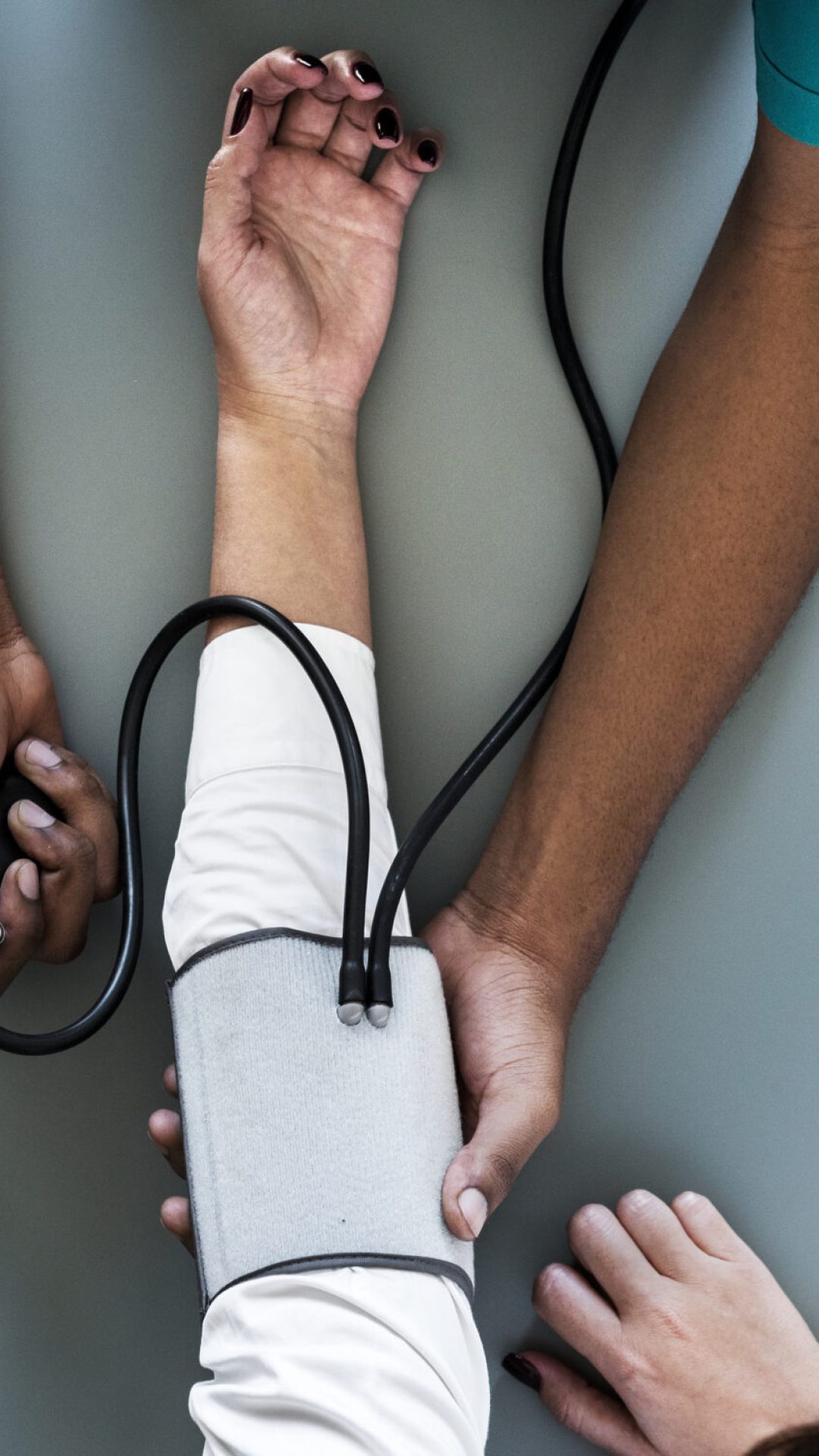 Nurse measuring patient blood pressure